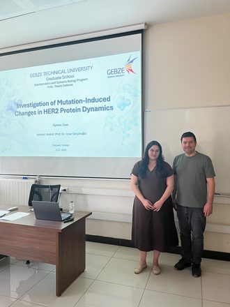 Öyküm Önel with her supervisor after her thesis defense